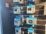 many boxes of electronics on the wall in the store