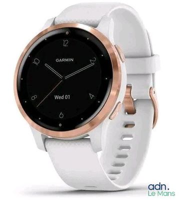 a close up of a white and rose gold garmin watch