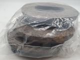 two donuts wrapped in plastic on a white surface