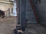 a horse that is standing inside of a building