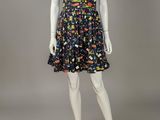 a mannequin dressed mannequin wearing a black and multicolored dress