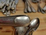 many spoons and spoon spoons sitting on a table