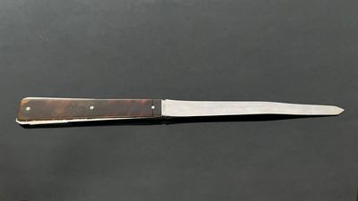 a knife that is sitting on top of a table
