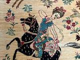 a rug with a picture of a woman riding on a horse