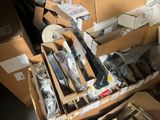 a pile of boxes with various items on top of them