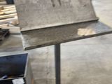 an image of a piece of metal in a factory