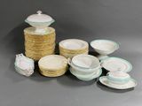 a lot of plates and bowls that are on the table