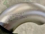 an image of a close up of a metal pipe on a table