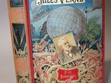 an old book with a picture of a man and a globe on it