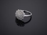 a close up of a diamond ring on a black surface
