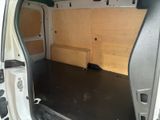 a white van with a wooden panel in the back of it