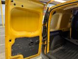 a yellow van with the door open in a parking lot