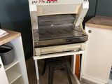 a machine that is sitting in a kitchen next to a counter