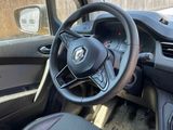 a steering wheel and dashboard of a small car