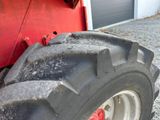 a large tire that is sitting in front of a building