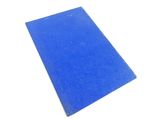 a close up of a blue sheet of paper on a white surface