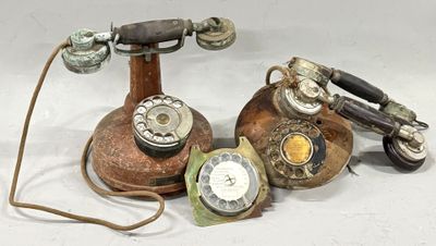 several old telephones that are sitting on a table