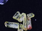 a close up of a group of yellow and green crystals
