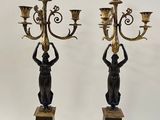 pair of antique brass and bronze candelabs with birds on them