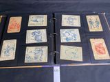 a lot of old stamps on a binder on a table