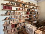 many books that are on the shelves in the room