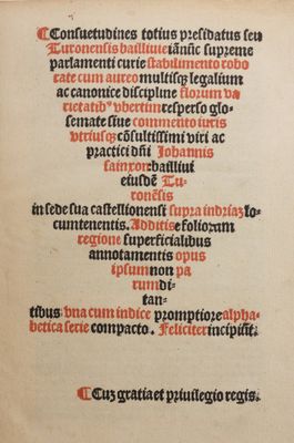 an old book with a red and black writing on it