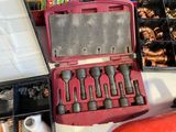 a box of tools sitting on a table next to a fire extinguisor