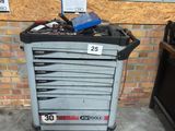 a tool cart with tools on it in a garage
