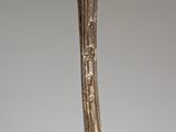 a close up of a spoon and fork on a table