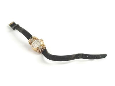 an image of a wrist watch with a black strap and a gold watch face