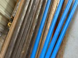 a lot of pipes that are sitting on a pallet