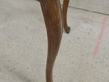 a small wooden table with a drawer on top of it