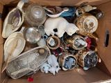 a cardboard box full of assorted items in it