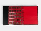 a red book with a lot of coins inside of it
