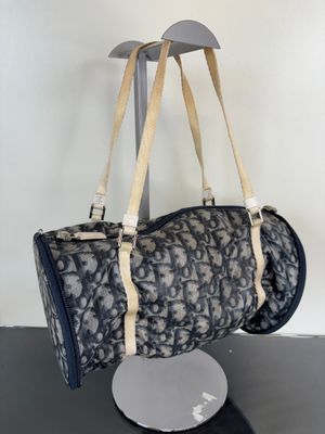 a bag that is hanging on a stand on a table