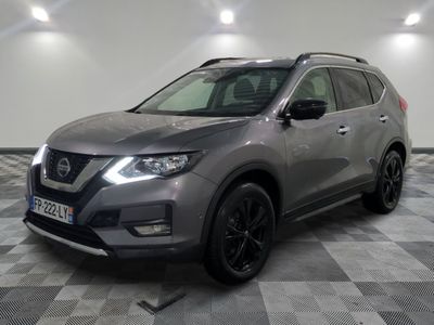 the nissan suv is parked in a large room with a checkered floor