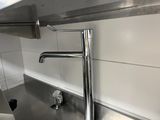 a sink with a faucet in the middle of it