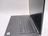 a laptop that is open on a white surface