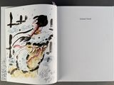 an open book with a drawing of a woman on a horse