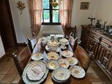 a dining room table with a lot of plates on it