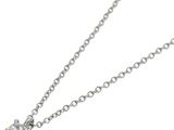 a close up of a diamond heart pendant on a chain