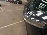 many cars parked in a parking lot in a parking lot