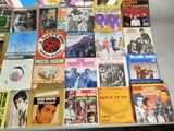 a lot of music cds on a table together