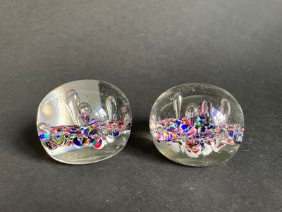 two clear glass bowls with colorful confetti on them