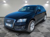 the black audi suv is parked on a checkered tile floor