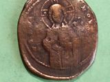 an old coin with a picture of a person on it