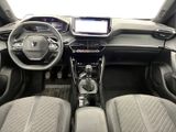 the interior of a car with a steering wheel, dashboard, and dashboard controls