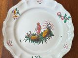 two plates that are sitting on a wooden table