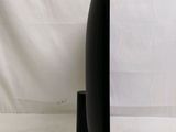 a black vase that is on a stand on a white background