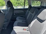 the interior of a car with two rows of seats in it